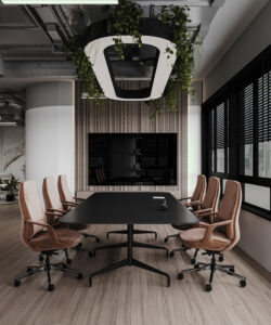 Modern meeting room in Dubai with black conference table, brown swivel chairs, ceiling light adorned with hanging plants, and a large presentation screen—by House of Kalaa.