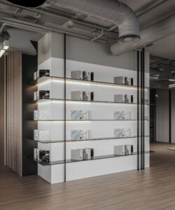 Dubai office interior featuring curved shelving with stone decor and books, ambient lighting, and exposed ceiling elements—designed by House of Kalaa.