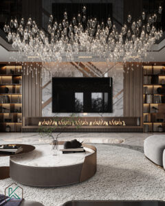 Dubai living room featuring marble flooring, circular rug, chandelier, built-in fireplace, wall-mounted TV, and sculptural bookshelf—designed by House of Kalaa.